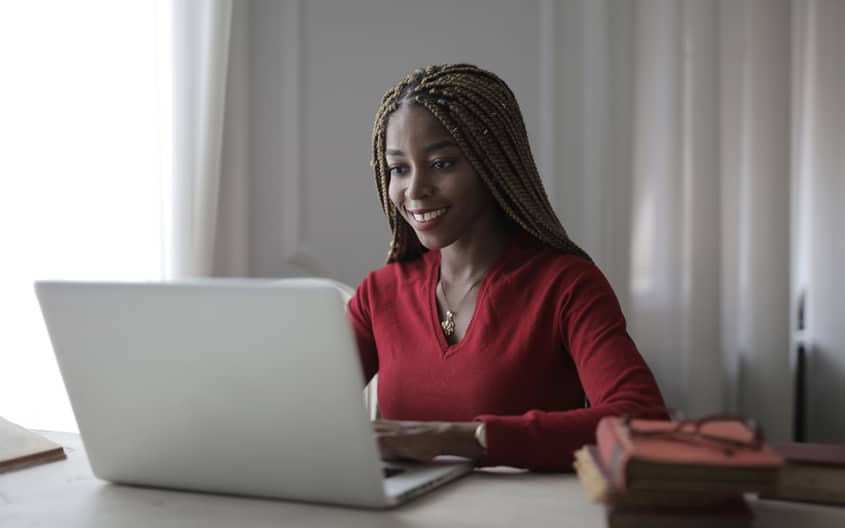 A woman engaged in an online therapy session